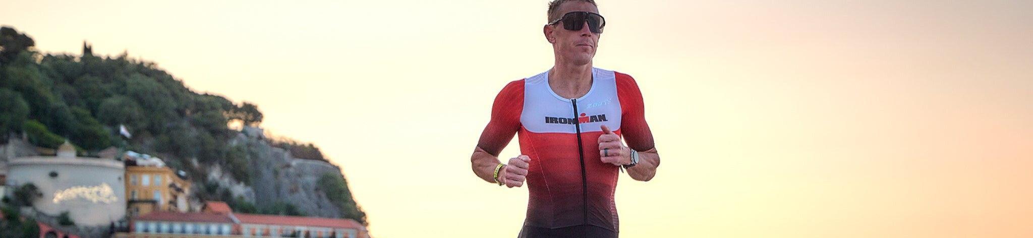Man running in triathlon suit